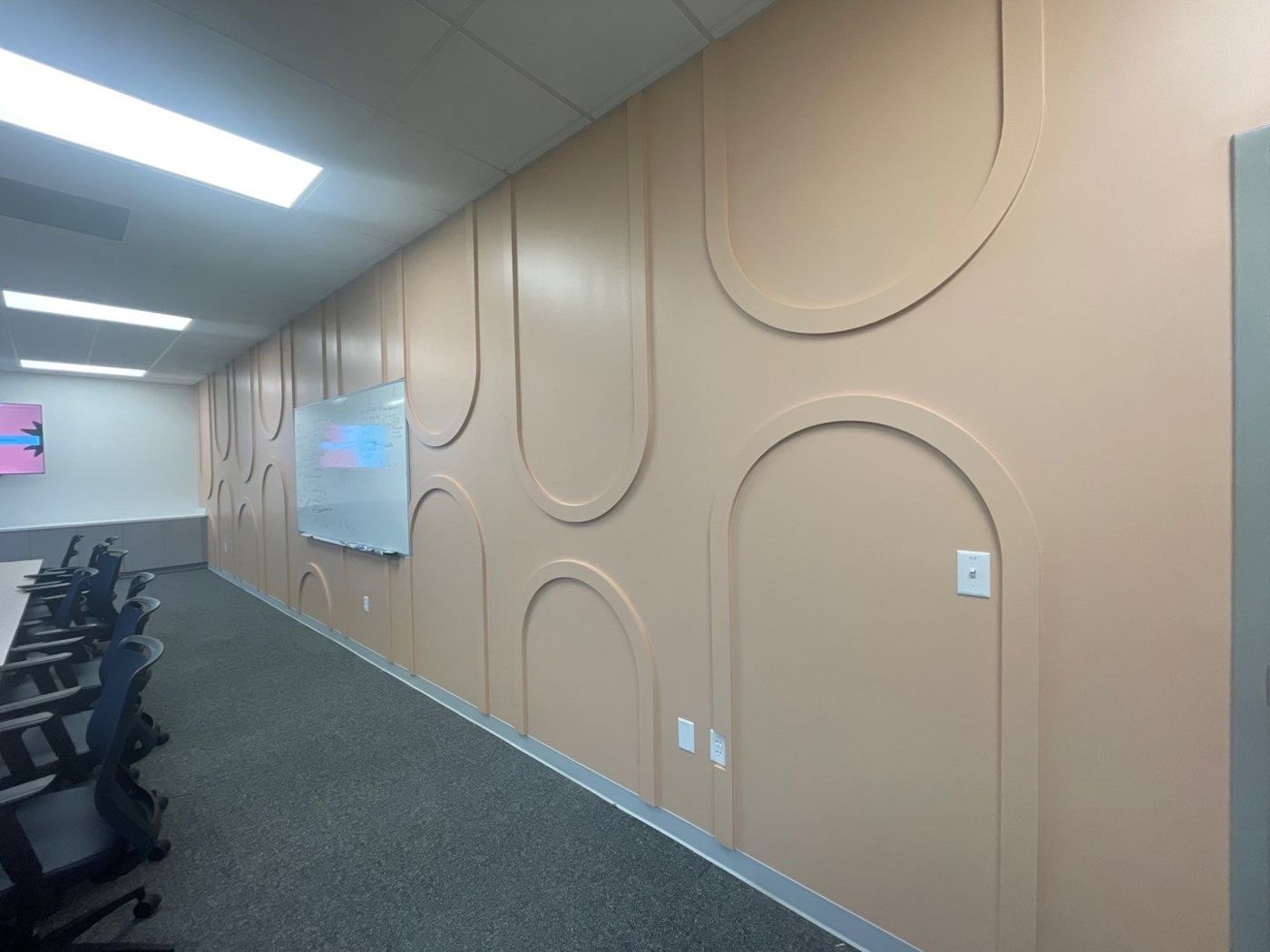 Dimensional arch wall panels fabricated for a conference room
