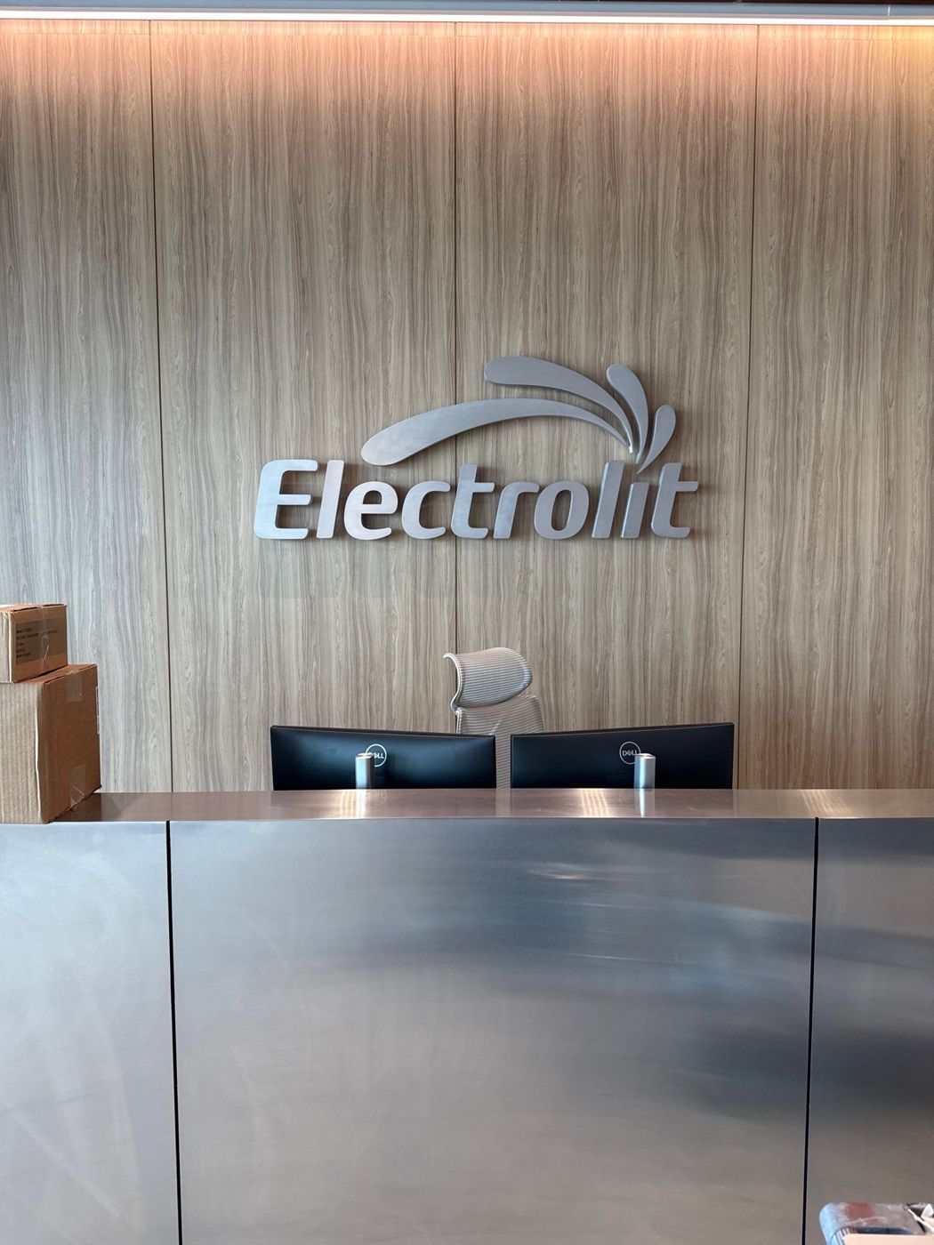 Brushed metal Electrolit logo at reception