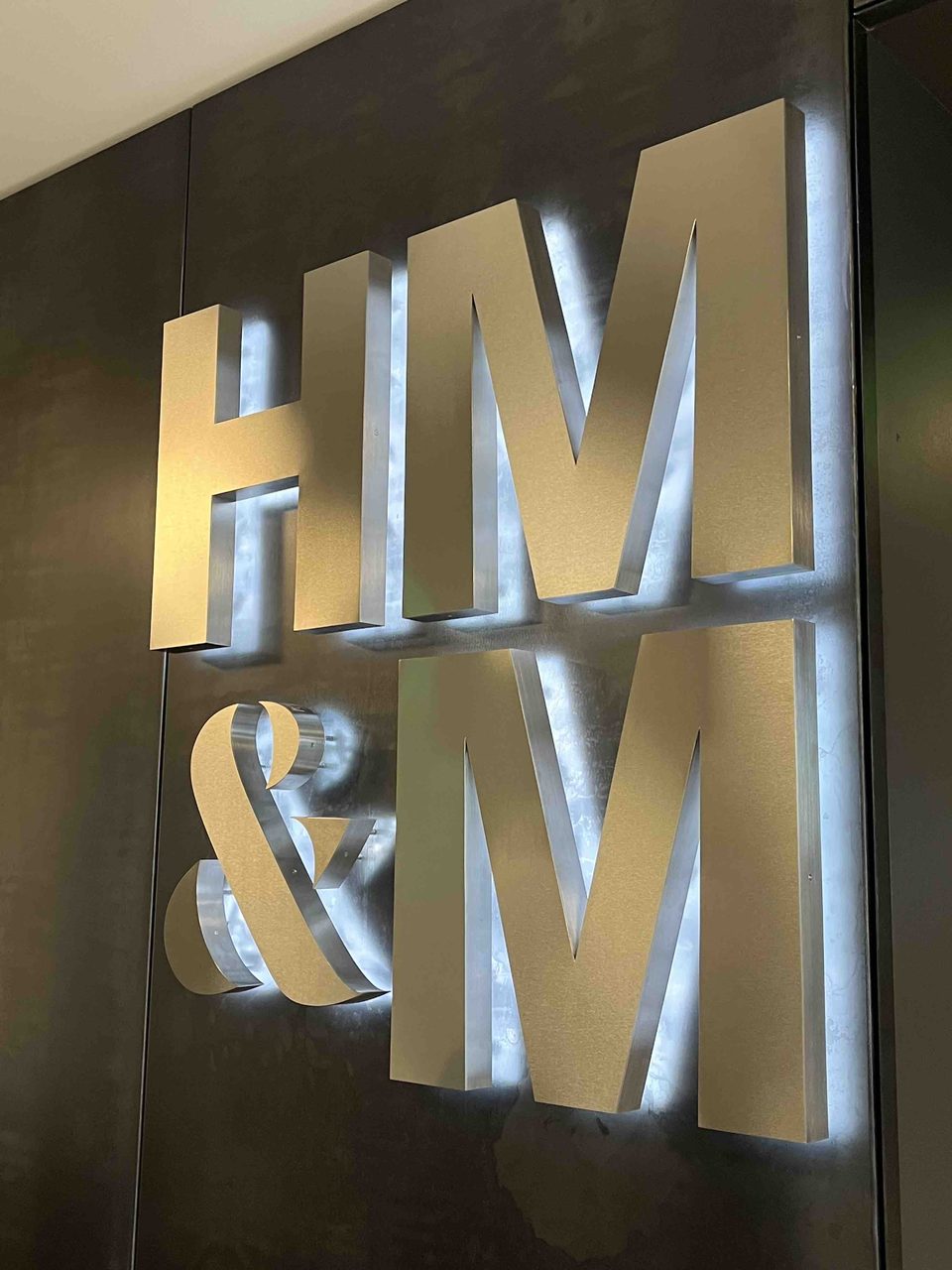 Halo-lit brass channel letters by Brown Graphics